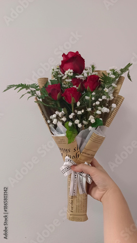 A vibrant bouquet of roses, showcasing a beautiful blend of red. Each flower tells a story of affection and beauty