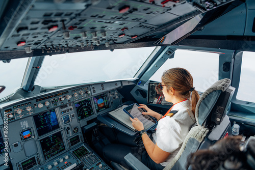 Female pilot using tablet for flight operations