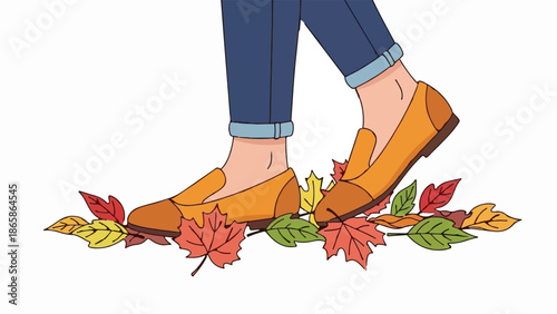 Person walks on fallen autumn leaves wearing casual shoes and rolled up jeans
