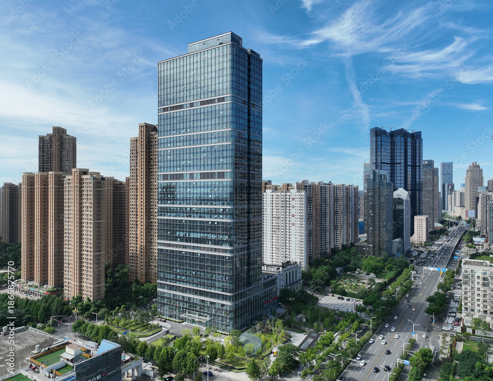 Obraz premium Modern Glass Skyscraper in Urban City Center Aerial View