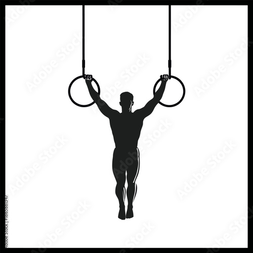 A male gymnast with a powerful athletic build is training on rings with strength and precision