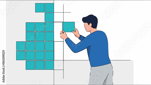 Person placing a blue square tile into a grid pattern