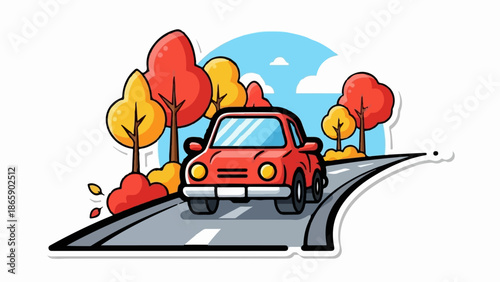 A red car drives down a road lined with colorful autumn trees under a blue sky