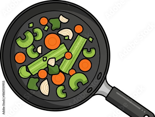 Top-down view of a black frying pan filled with chopped vegetables