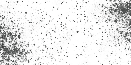 Dark gray speckle texture on white background with clusters on edges splatter grunge