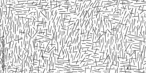 Black and white abstract pattern of random short lines and dashes background texture