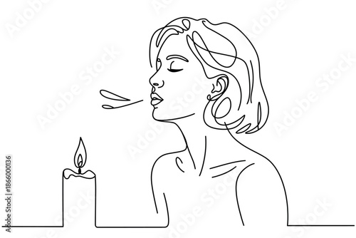 A woman blowing out a candle in a peaceful moment of meditation and relaxation