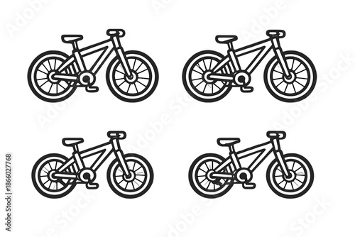 Four identical white bicycles on a dark background