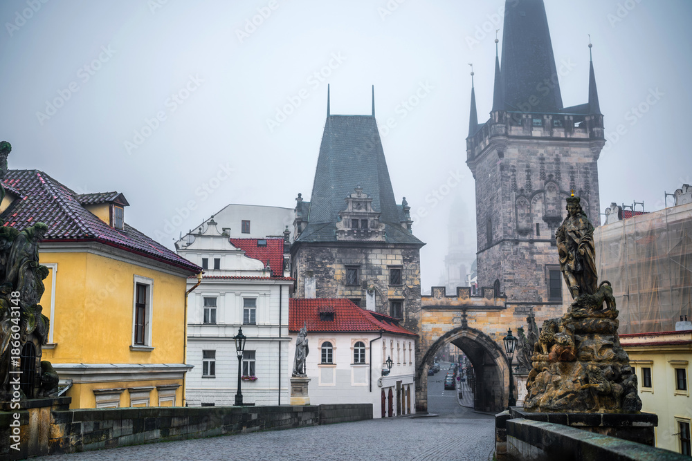 Fototapeta premium Mysterious Charles Bridge In Prague: An Exciting Sightseen In A Light Mist