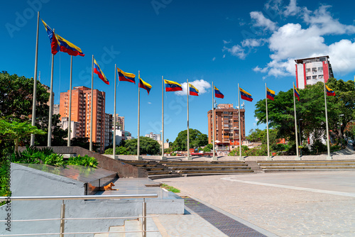 Quadro su tela Caracas city with Venezuelan flags in the wind