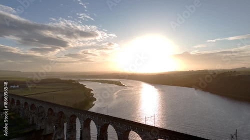 Wallpaper Mural Aerial view of the Royal Border Bridge spanning a river, reflecting the light of the rising sun, a tranquil scene, Berwick-upon-Tweed, England, United Kingdom. Torontodigital.ca