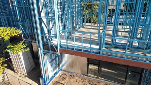 Steel frame house under construction, modern residential building site