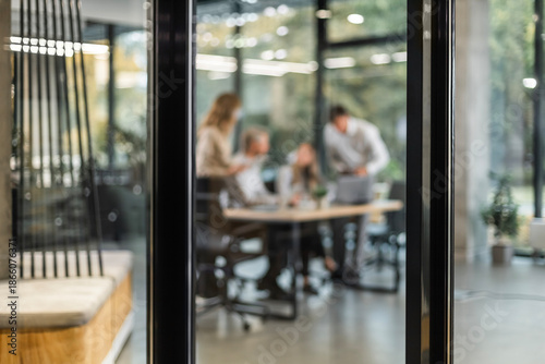 Photos Businessmen blur in the workplace in office with computer or shallow depth of fo
