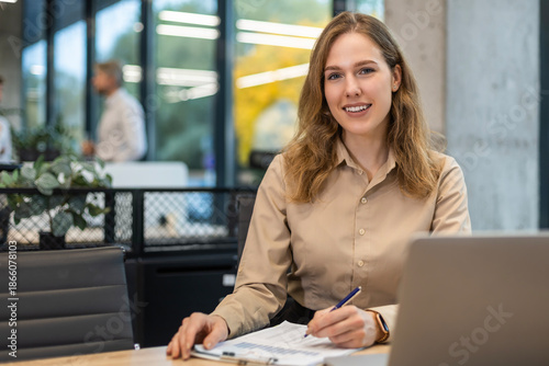 Foto Portrait of happy and successful business woman inside office at workplace, work