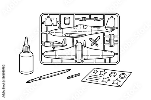 Line art model airplane kit with tools on assembly tray