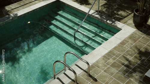 Private Swimming Pool with Steps and Handrail.