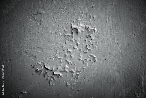 Fotografie Close up of peeling white paint texture on an old weathered wall.