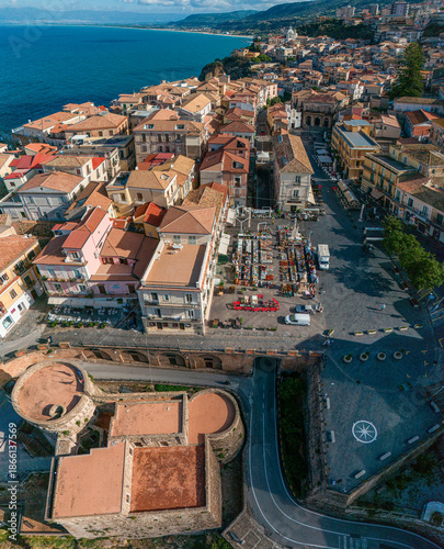 Aerial view of Pizzo Calabro, pier, castle, Calabria, tourism Italy. Panoramic view of the small town of Pizzo Calabro by the sea. Houses on the rock. On the cliff stands the Murat Aragonese castle