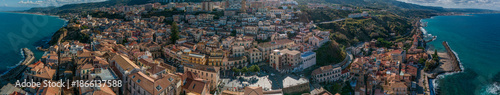 Aerial view of Pizzo Calabro, pier, castle, Calabria, tourism Italy. Panoramic view of the small town of Pizzo Calabro by the sea. Houses on the rock. On the cliff stands the Murat Aragonese castle