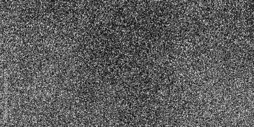 Fotografie The rough surface texture of sand grains and small stones gives an industrial and abstract impression