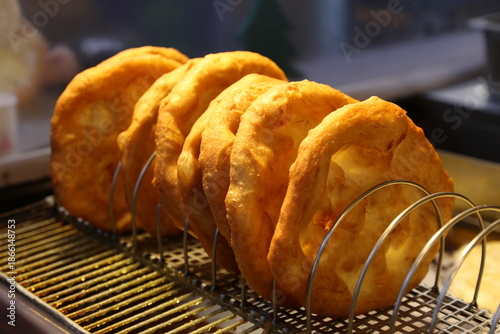 Freshly baked traditional hungarian langos langosch langosh in row for sale