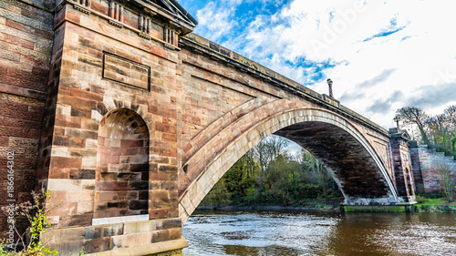 A view looking through the arch of the Grosvenor Bridge up the River Dee in the city of Chester, Cheshire, UK