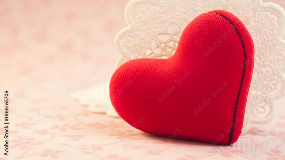 Fototapeta premium Happy valentine's day wishes with a red heartfelt plush toy