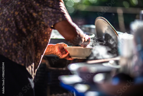 The background of the cooking is from a charcoal stove, resulting in an aromatic blend of ancient spices. The soup has a delicious flavor.