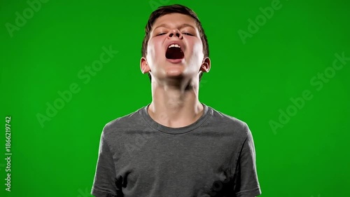 Young man celebrating with fists raised in excitement and joy