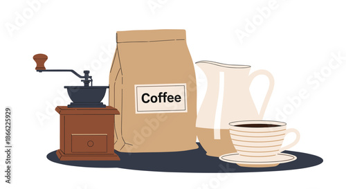 Still life arrangement of coffee making essentials features a manual grinder a bag of beans a creamer pitcher and a fresh cup of coffee.