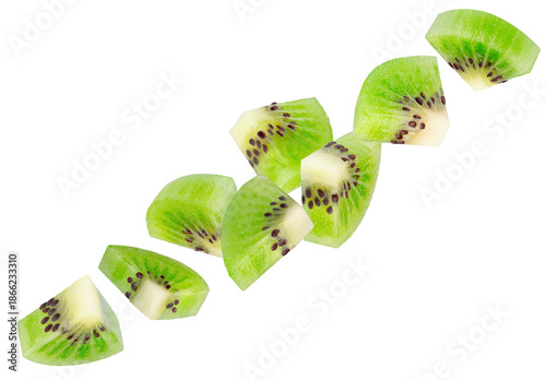 Peeled triangular kiwi slices fly through space in a chain shape. Isolated on white.