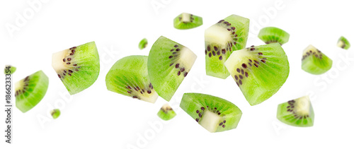 Peeled triangular kiwi slices fly and levitate in space. Isolated on white.