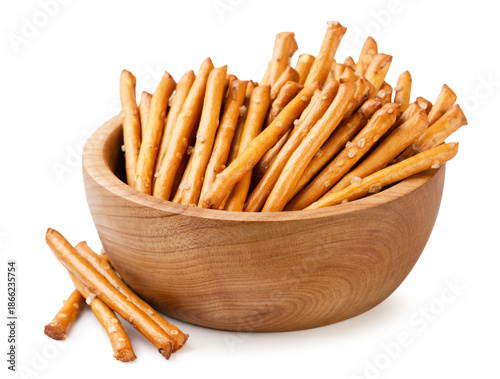 Pretzel sticks in a wooden plate on a white background. Isolated