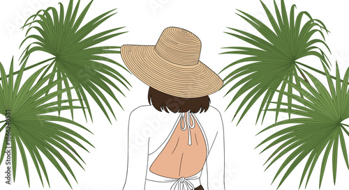 Stylish woman wearing a large sun hat and white backless top seen from behind surrounded by tropical green palm leaves in summer.