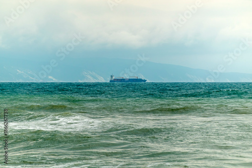 August 24, 2025: Large cargo ship entering the port of Novorossiysk, Russia, on the Black Sea, illustrating maritime transport, industrial shipping and coastal infrastructure