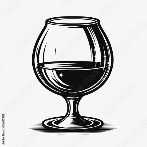 Vintage glass of dark beverage with reflections on light background for alcohol concept