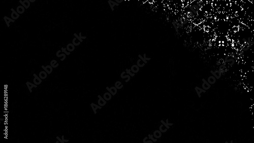 Abstract rain and snow drops falling on a black night background with glowing light. Black and white paint splash texture background with abstract liquid drops and grunge pattern illustration.