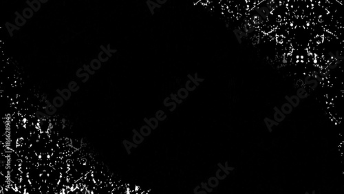 Abstract rain and snow drops falling on a black night background with glowing light. Black and white paint splash texture background with abstract liquid drops and grunge pattern illustration.
