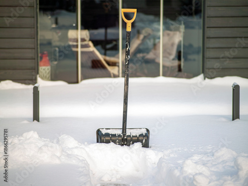 Photography digging a passageway in the snowdrifts