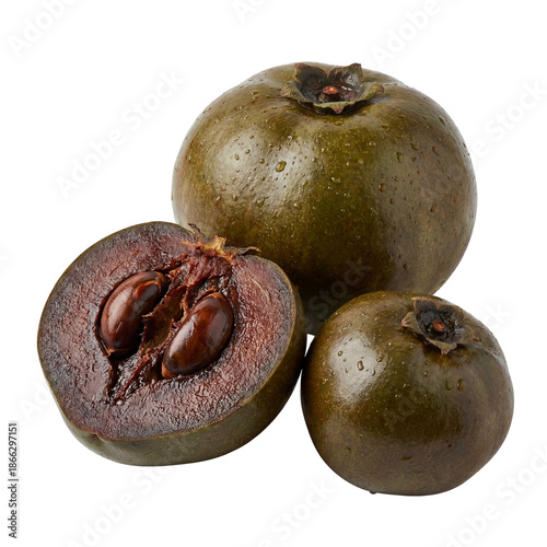 Ripe black sapote fruit with olive-brown skin and water droplets, sliced open to reveal rich dark chocolate-like flesh and glossy seeds, highlighting exotic tropical texture and natural ripeness.