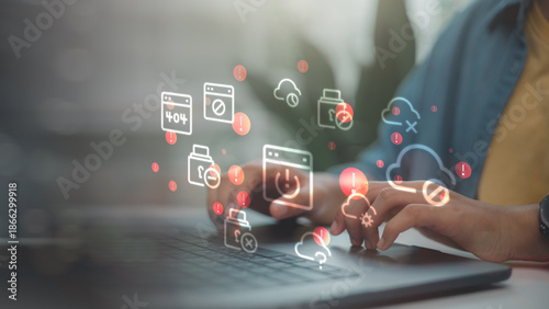 Businessman using laptop with 404 error and system failure icons. Server down, internet connection lost and website maintenance concept. Cyber security technology problem.
