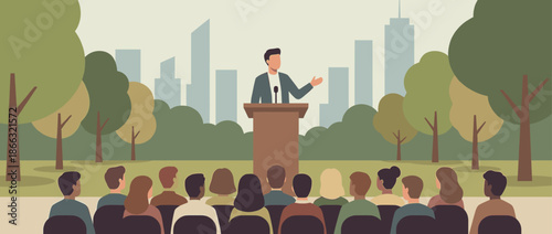 Male politician speaking at a podium with a microphone to a crowd of people during an outdoor rally in a city park with a skyscraper skyline in the background