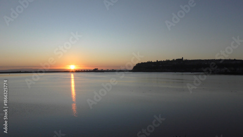 Calm Morning Sunrise over Cardiff Bay showing still water and the Barrage