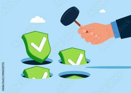 Hand holding hammer hitting the green shields check marks symbols in a mole hole. Playing hamster game. Business constraints or stagnant, prohibition or difficulty prevent from improvement or success.