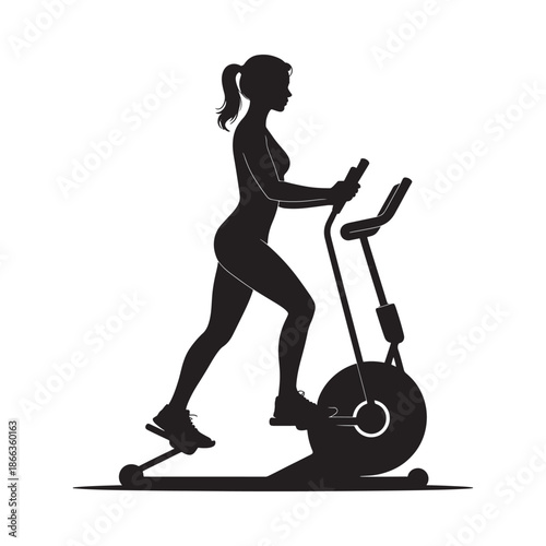 Silhouette of a woman exercising on an elliptical machine indoors