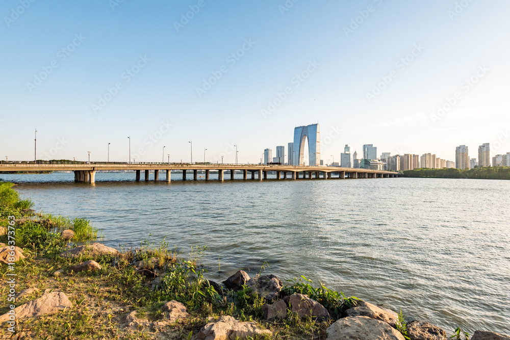 Fototapeta premium Suzhou Modern Bridge and City Skyline Over River