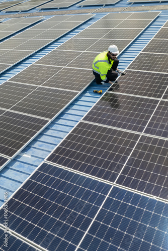 Verticle view of engineers checking on solar panel