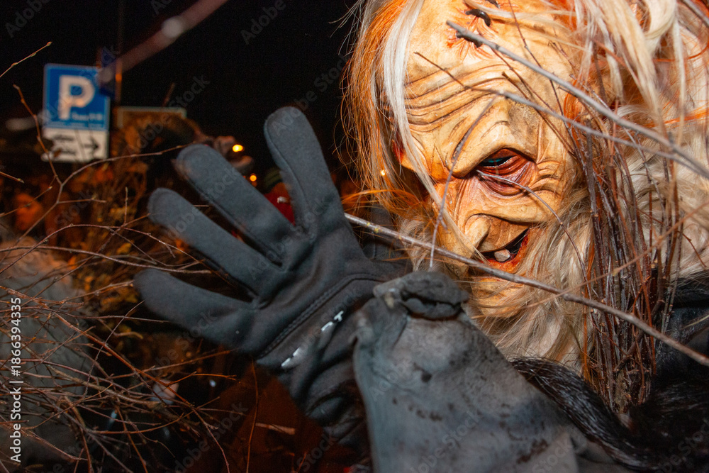 Obraz premium Dobbiaco Krampus Festival: Medieval masks parade through South Tyrol, originating from Northern Europe