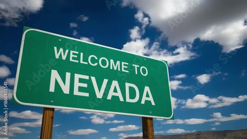 Welcome to Nevada road sign with beautiful blue sky and clouds
