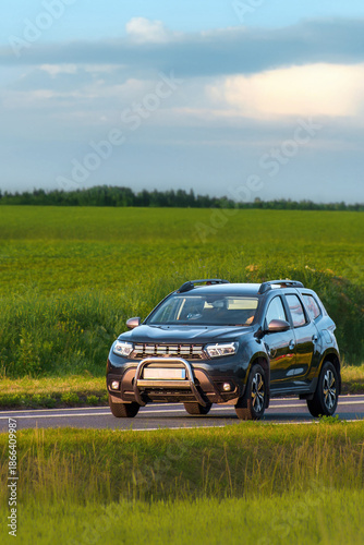 Modern European city SUV on rural highway